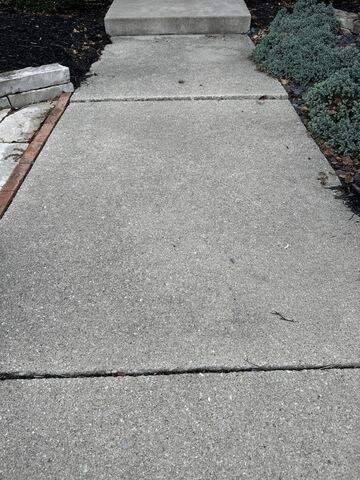 Crack repair, leveling and sealing a concrete driveway in Findlay, OH