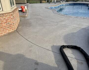 Sealing joints on patio and around pool coping in Sylvania, OH