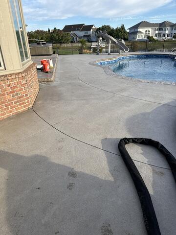 Sealing joints on patio and around pool coping in Sylvania, OH