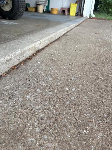 Repairing a cracked driveway in North Ridgeville, OH.