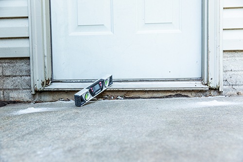 Repairing a cracked driveway in North Ridgeville, OH.
