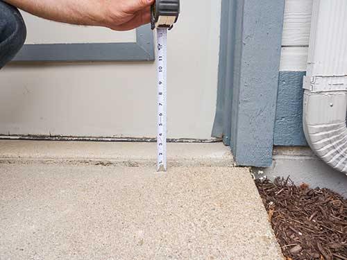 Repairing a cracked driveway in North Ridgeville, OH.