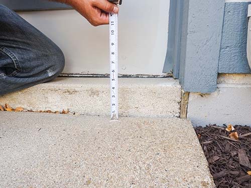 Repairing a cracked driveway in North Ridgeville, OH.