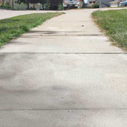Repairing a cracked driveway in North Ridgeville, OH.