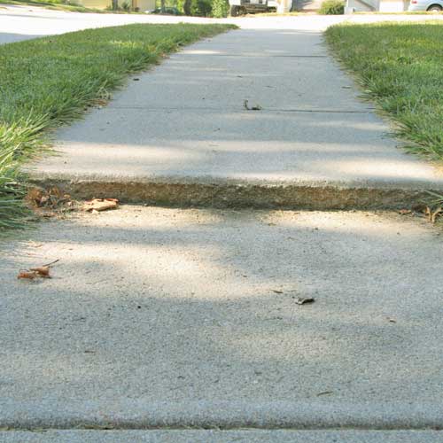 Repairing a cracked driveway in North Ridgeville, OH.