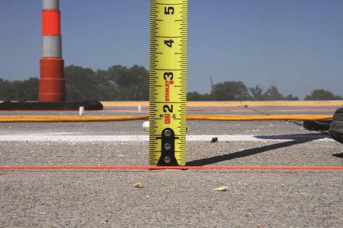 Repairing a cracked driveway in North Ridgeville, OH.