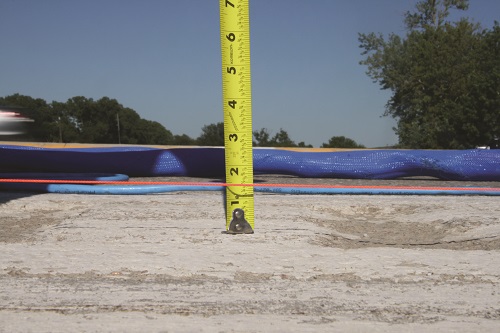 Repairing a cracked driveway in North Ridgeville, OH.