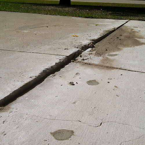 Repairing a cracked driveway in North Ridgeville, OH.
