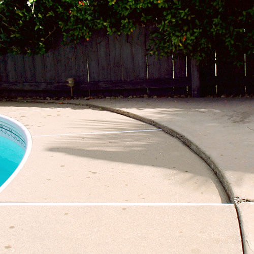 Repairing a cracked driveway in North Ridgeville, OH.