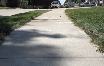 Repairing a cracked driveway in North Ridgeville, OH.