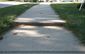 Repairing a cracked driveway in North Ridgeville, OH.