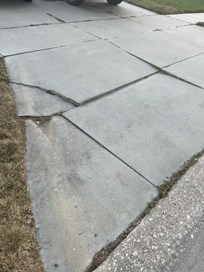 how-concrete-lifting-and-leveling-can-save-your-sunken-driveways-image sunken concrete driveway
