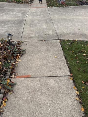 sunken concrete sidewalk trip hazard